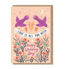 Two purple doves holding banner, wedding day card